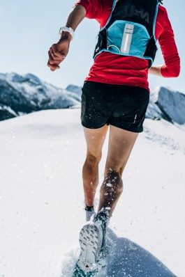  Female Runner running through fresh snow
